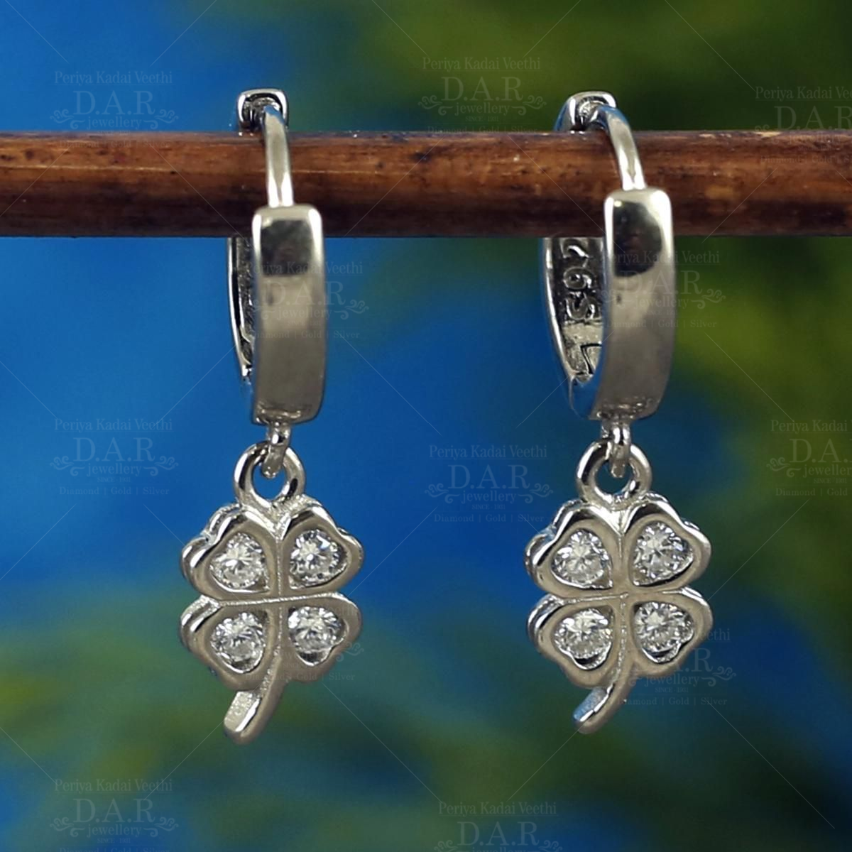 Sterling Silver Created White Opal Tear Bali Earrings